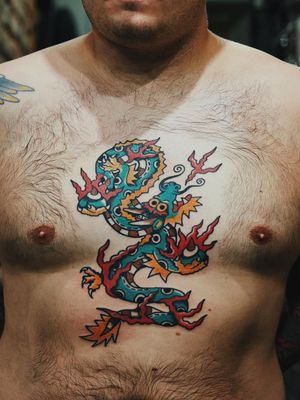 Dragon tattoo by Liam Alvy #LiamAlvy #NauticalTattoos #sailortattoos #sailors #traditionaltattoos #traditional #AmericanTraditional #nautical #dragon #chest