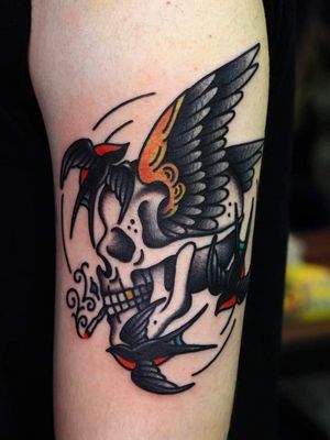 Swallow tattoo by Mick Gore #MickGore #NauticalTattoos #sailortattoos #sailors #traditionaltattoos #traditional #AmericanTraditional #nautical #swallow #skull #bird #upperarm #arm #bicep