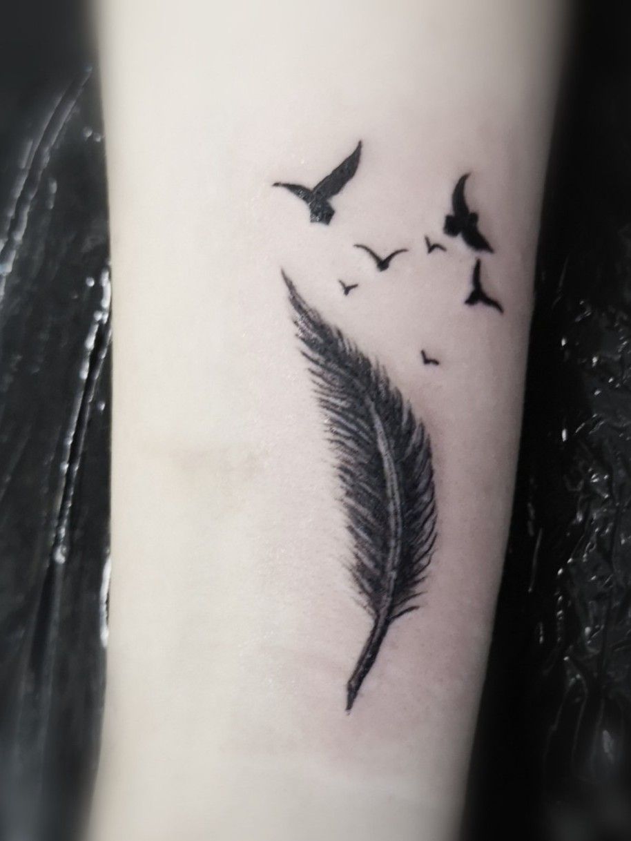 Pin on Feather tattoo with initials on side wrist