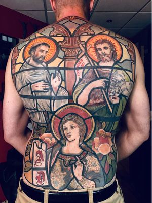 Stained glass tattoo by Mikael De Poissey #MikaelDePoissey #backtattoo #stainedglass #portrait Top 10 Cities to Get Tattooed In #Paris #tattooidea #tattoo #tattooart #vacation #travel #top10 #top10cities #gettattooed