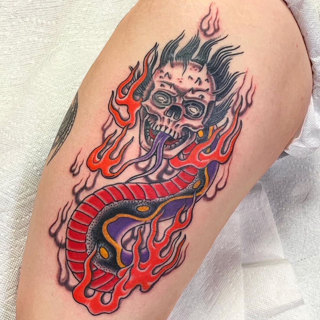 Grey Ink Skulls And Flames Tattoo On Man Left Sleeve