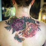 Flower tattoo by Alice Kendall #AliceKendall #flowertattoo #backtattoo #butterfly - Top 10 Cities to Get Tattooed In #Portland #tattooidea #tattoo #tattooart #vacation #travel #top10 #top10cities #gettattooed
