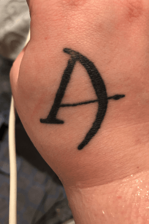 Bow and arrow in the shape of an A for the goddess Artemis