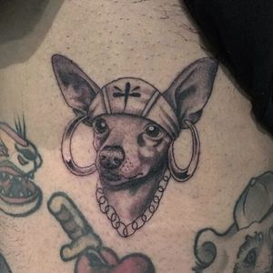 Chicano tattoo by #AlejandroLopez #chicano #chicanotattoo #blackandgrey #traditional #oldschool #illustrative #dog #petportrait #pup #stomach #bandana #hoopearring