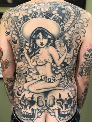 Chicano tattoo by #AlejandroLopez #chicano #chicanotattoo #blackandgrey #traditional #oldschool #illustrative #lady #skulss #guns #coinclouds #clouds #skeleten #dice #roses #cobra #backpiece #back