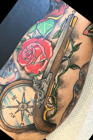Musket and compass tattoo