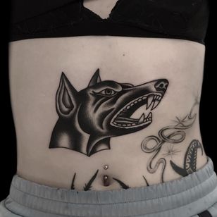 Dog tattoo by Austin Maples #AustinMaples #stomachtattoo #stomach #blackwork #traditional #doberman #dogtattoos #dog #dogs #petportrait #animal #bff #pet #canine