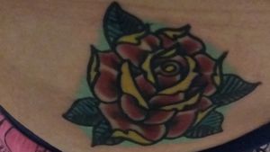 This was my first ever tattoo. I got it at the same tattoo parlor as my wolf one. I got this for my nana and mother. We all love roses in my family but my nana could never have real ones cuz she was allergic.