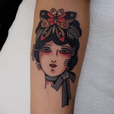 Traditional lady head tattoo by Ivan Antonyshev #IvanAntonyshev #forearm #arm #color #butterfly #bow #traditionalladyhead #traditional #oldschool #ladyhead #lady #portrait #pinup