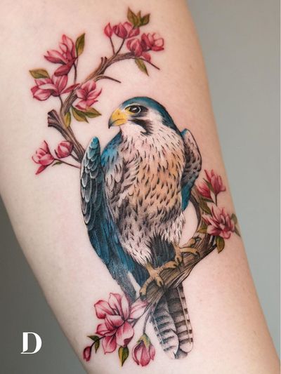 Beautiful tattoo by Deborah Genchi #DeborahGenchi #debartist #realism #realistic #illustrative #watercolor #color #falcon #bird #feathers #nature #animal #flowers #floral #treebranch #tree #upperarm #arm