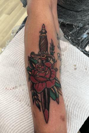 Traditional dagger/rose done on the forearm 