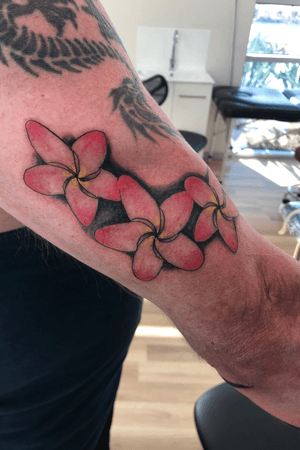 Some frangipanis done on the upper arm