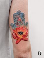 Beautiful tattoo by Deborah Genchi #DeborahGenchi #debartist #realism #realistic #illustrative #watercolor #color #lotus #eye #thirdeye #hamsa #hand #buddhism #Hinduism #flower #floral #upperarm #arm
