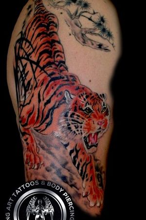 This tiger was done on a good friend that loves the Japanese style of tattoos as much as me and this was one of the first of many Japanese style tattoos we did on him Thank you and I will always be grateful and honored that you carry my art