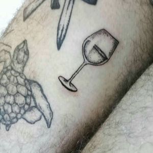Wine glass.  Lineal black tattoo. Pointillism. My first as tattoer.