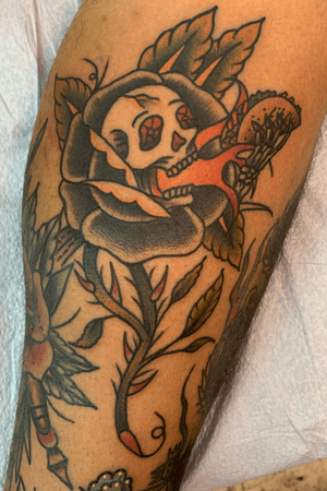 Drawn on traditional taco skull rose on a calf filling gaps around some other drawn on pieces 