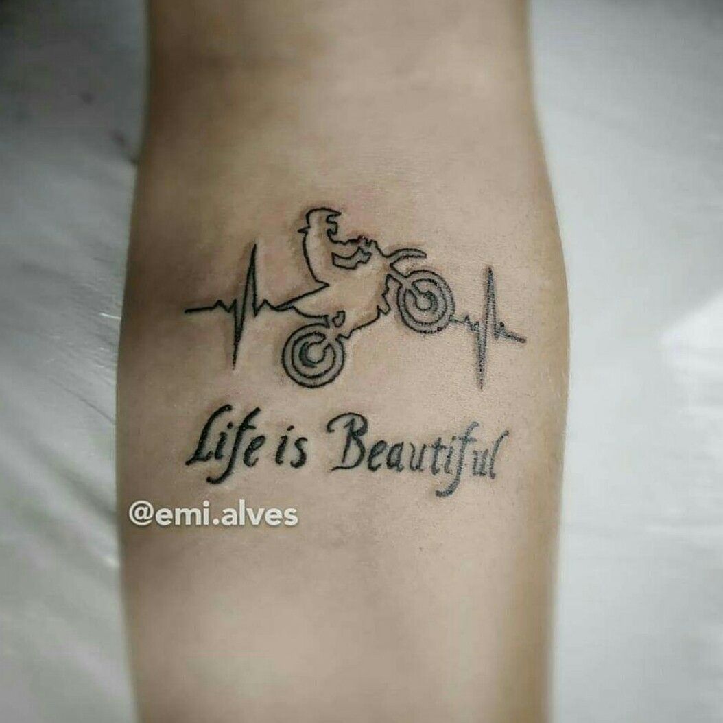 Small minimalist bike tattoo on the left inner wrist.