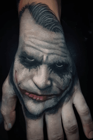 Heath Ledger as the Joker on the hand, by @hobotattoo