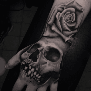 Classic Skull and Rose combo by @hobotattoo