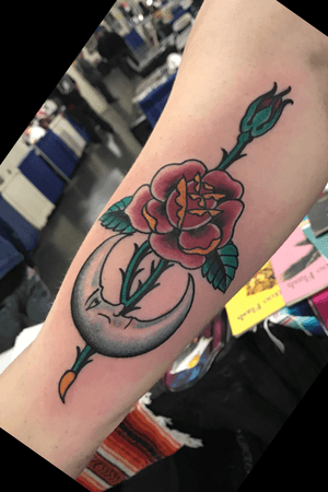 A moon dude holding a rose. #traditionaltattoo #Traditionalrose #moon #moontattoo #color #feminine #girlswithtattoos #ladieswithtattoos 