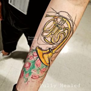 French horn with tulips