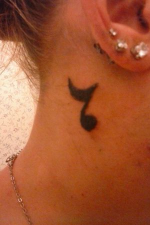 A music note, on my neck, bc music is always in my head, it's backwards Bc music turns me around
