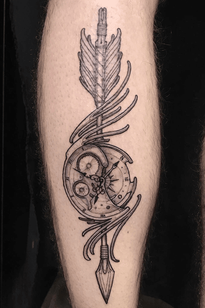 Custom arrow + conpass + clock piece with simple metal work like filigree.