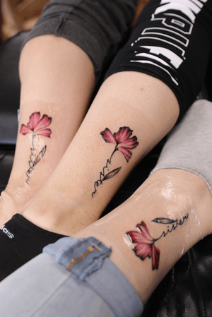 Sister matching tattoos