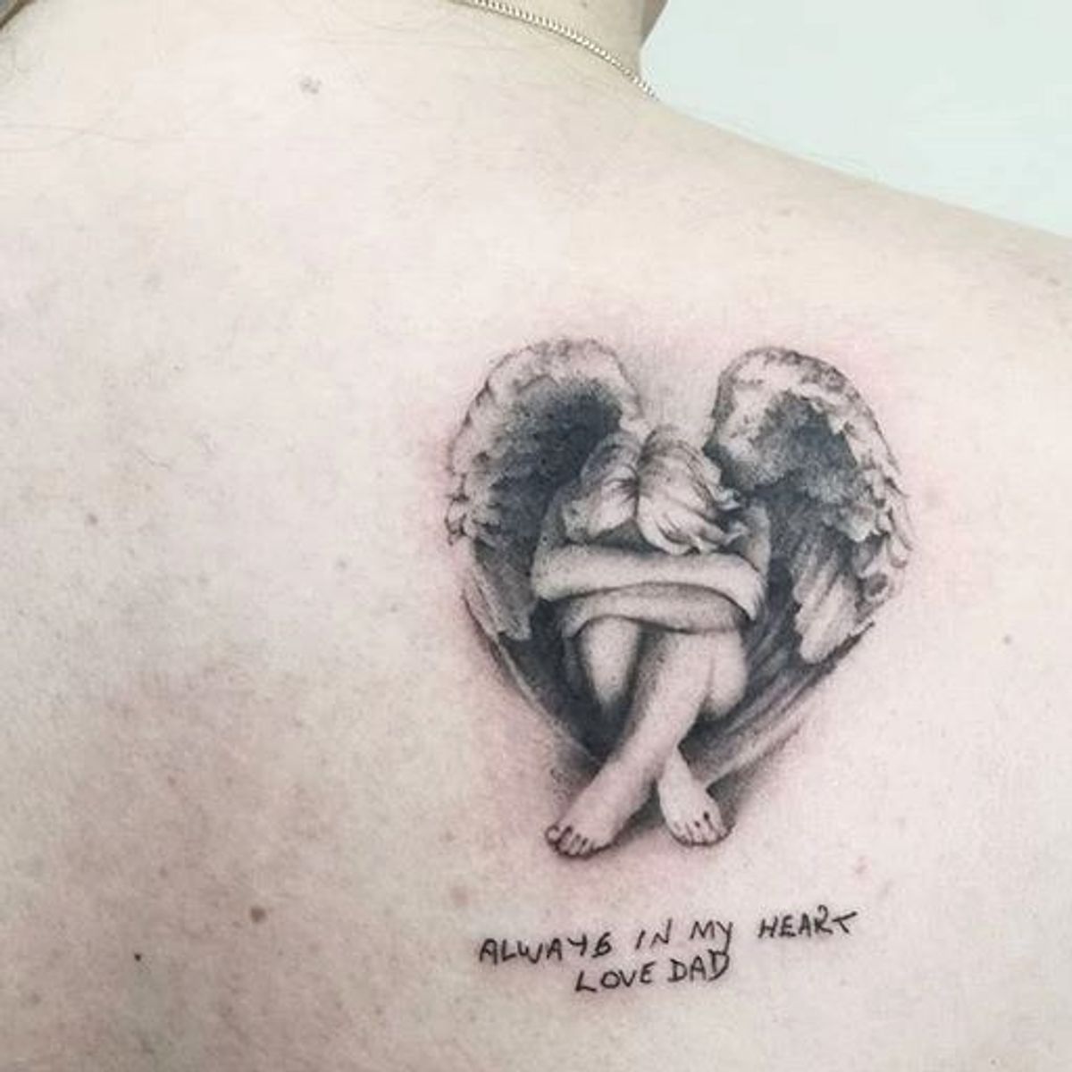 angel crying tattoo