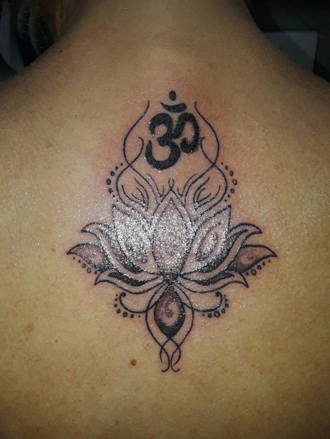 Tattoo uploaded by Michele Wilson • Chakra symbol Third eye chakra with  lotus flower. Still needs the purple added and doing that asap! The  placement is approx on the 3rd vertebrae of