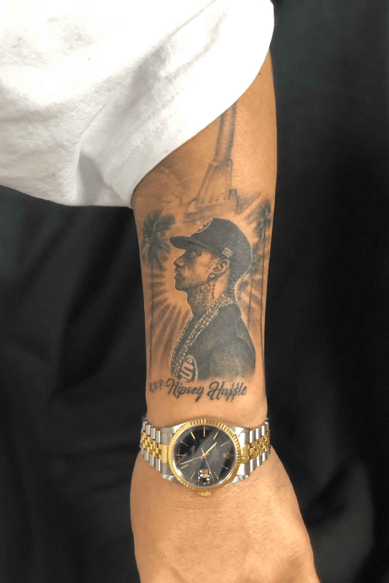 Lauren London Gets Nipsey Hussles Face Tattoo on Her Arm Real Love Never  Dies