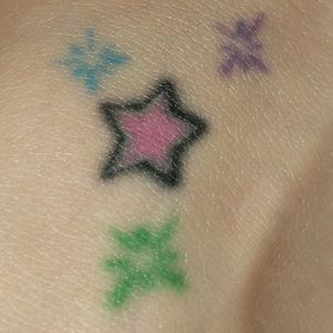 Stars and sparkles on right foot! First tattoo