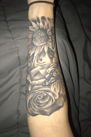This is for my mom. Roses are her favorite flower and sunflowers are my favorite flower. The purple butterflies are the symbol for lupus, which my mom has. 