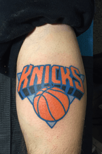 New York Knicks logo on the calf