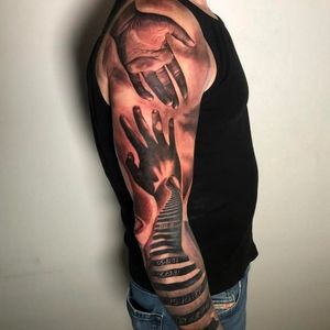 Black and grey realistic full sleeve of memorial hands reaching out to each other, London, UK | #blackandgrey #realism #tattoos