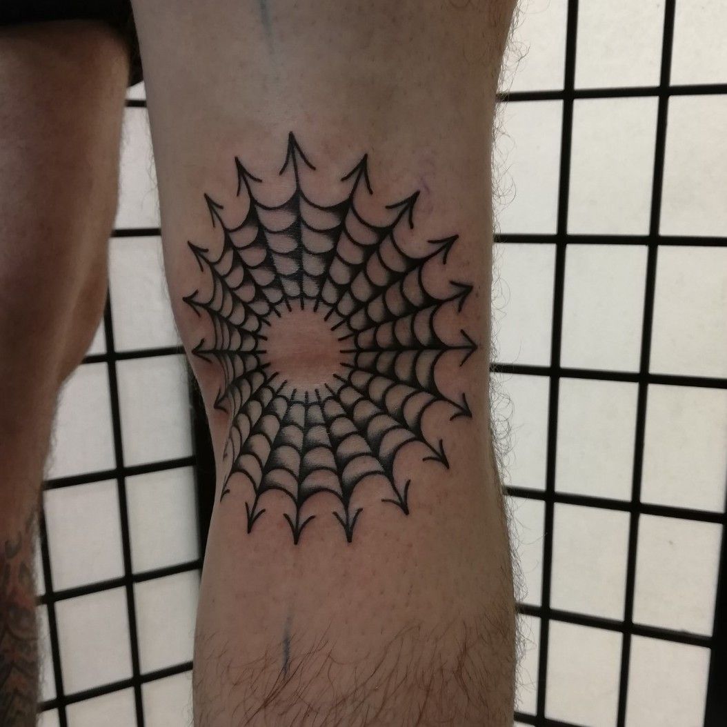 Spiderweb tattoo on the knee
