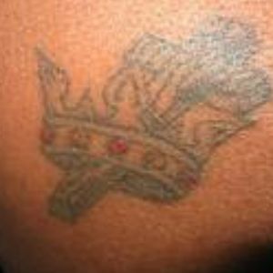 A cross with a crown on my back
