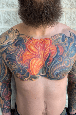 Lilly and biomech chest tattoo. 