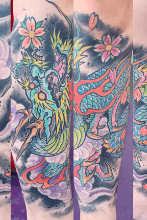 Japanese dragon tattoo on females leg in color