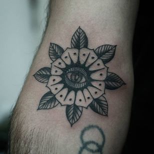 Eye tattoo by Franco Maldonado #FrancoMaldonado #eyetattoos #eyetattoo #eye #flower #floral #traditional #blackwork #leaves #nature #plant #arm