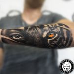 Forearm eyes tattoo Black and grey realistic #blackandgrey #eyes #eyetattoo #tigertattoo #tiger #lady #realism #realistic