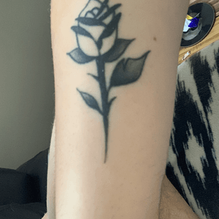 Small rose on left arm