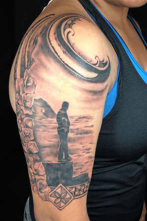 A memorial fusion piece done with Dynamic black and Empire Inks featuring a loved one’s silhouette, gladioli flowers, and Tongan tribal.