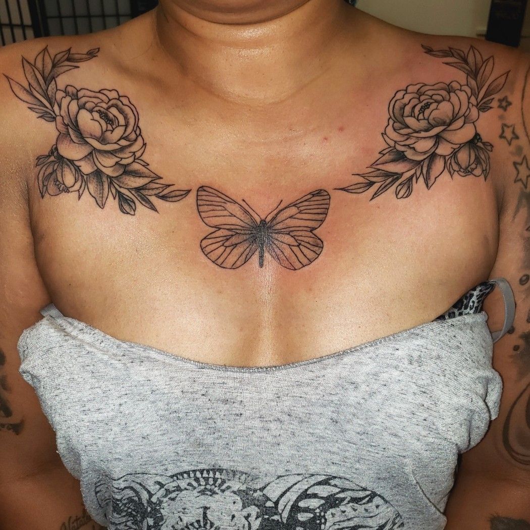 Butterfly tattoo chest with flowers