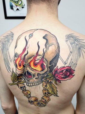 Unique neo-traditional skull design by Adrian Suez, perfect for upper back placement