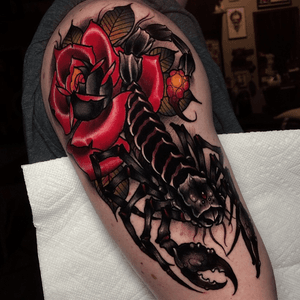 Scorpion and rose on the upper arm