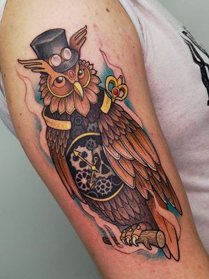 Get a wise and majestic owl inked on your upper arm with this stunning neo traditional design by talented artist Adrian Suez.