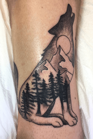 Wolf with mountains and trees on ankle 