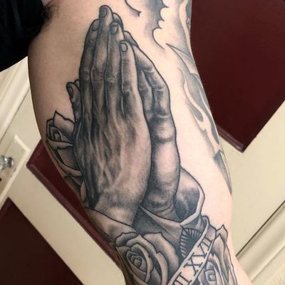 Clapper tattoo by Tim Hendricks #TimHendricks #blackandgrey #oldschool #traditional #chicano #rose #flower #banner #romannumerals #arm #clappertattoo #clappers #prayer #hands #religious #jesus #mary #iconic