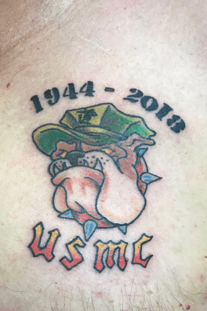 Marine Corps memorial tattoo done on a customer with muscle spasms from his own accidents. 